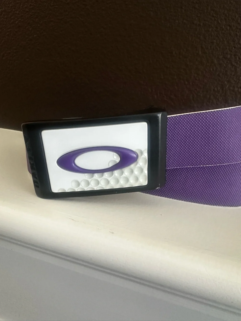 Oakley Belt Buckle with Purple Belt.